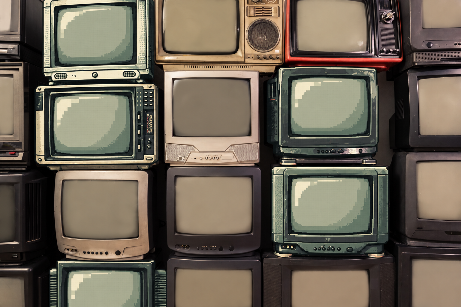 A wall of vintage televisions with muted screens